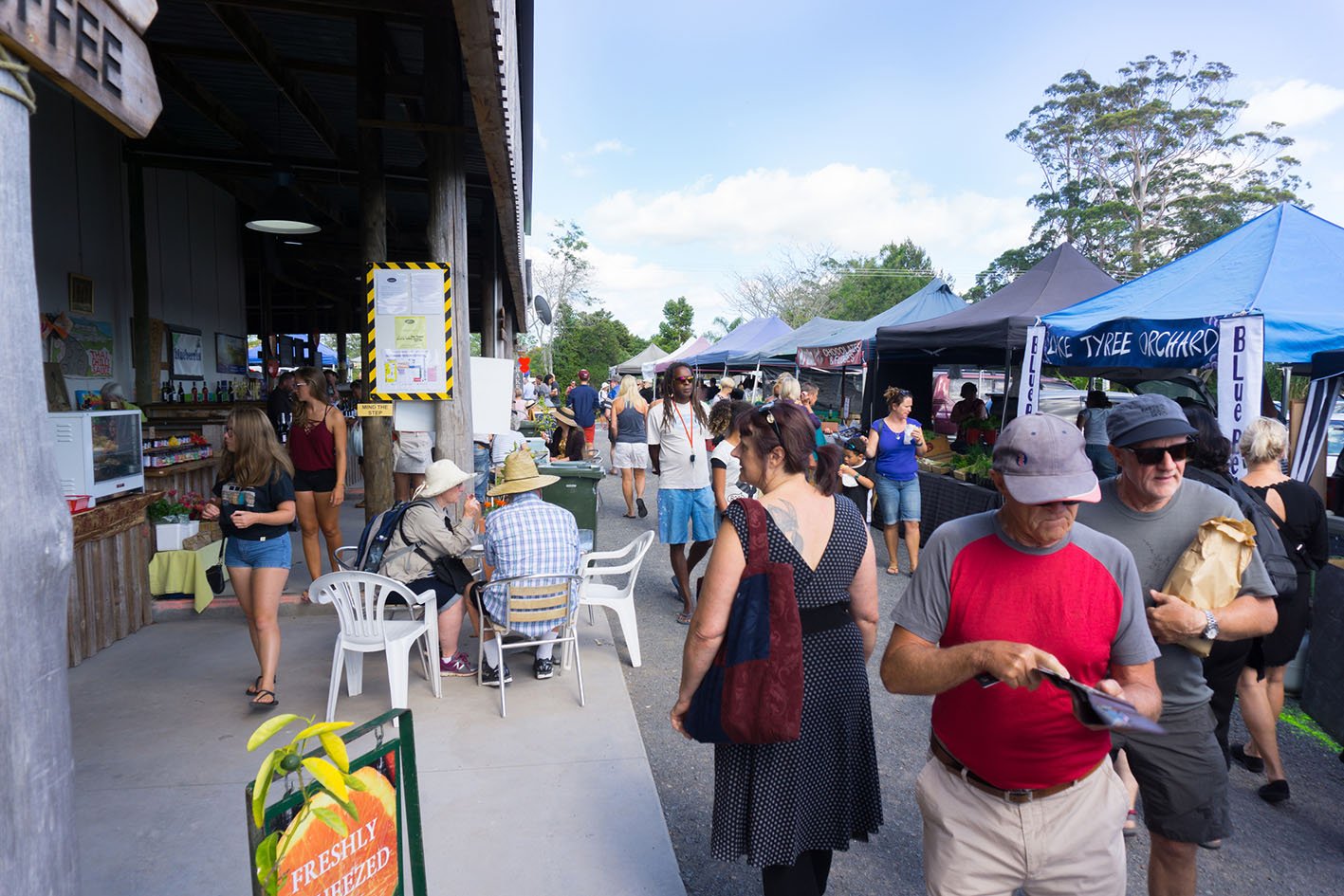 02/11/2017 Old Packhouse Market stalls and people wandering amongst vendors stalls and food sellers Kerikeri New Zealand.
